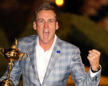 MEDINAH, IL - SEPTEMBER 30: Ian Poulter of England celebrates with the Ryder Cup after the Singles Matches for The 39th Ryder Cup at Medinah Country Club on September 30, 2012 in Medinah, Illinois. (Photo by Ross Kinnaird/Getty Images)