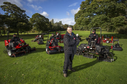 Rhuddlan’s course manager John Morris, centre, and his greenkeeping team, seated, with their reliable Toro fleet