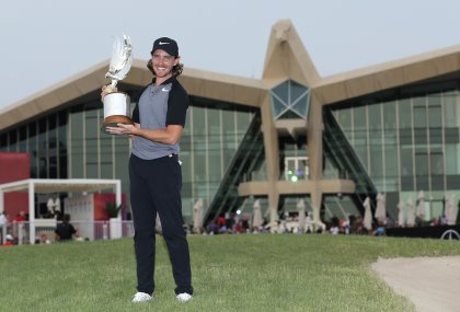 Tommy Fleetwood of England holds the trophy after he won the Abu Dhabi Golf Championship, in Abu Dhabi, United Arab Emirates, Sunday, Jan. 22, 2017. (AP Photo/Kamran Jebreili)