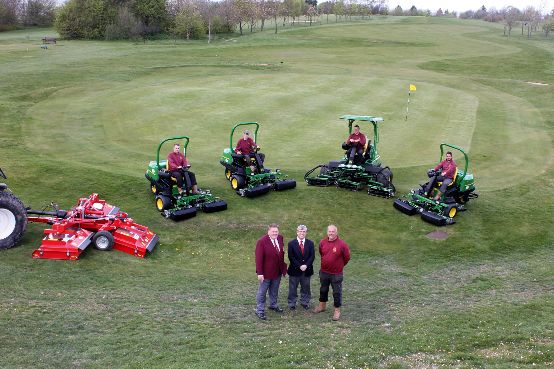 (Front left) Dunstable Downs Golf Club captain Mick Doyle, general manager Duncan Mutton and deputy head greenkeeper Gary Bolton with the greens staff and the new John Deere machinery fleet